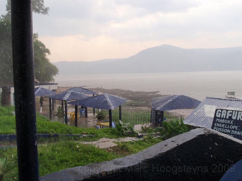 Maluku, a KInshasa port drenched in monsoon rains. Cool runnings with a Prilmus in my hands after having spend 3 hot hours on t.jpg